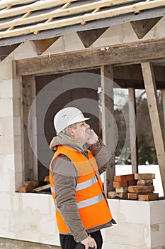 Construction manager talking on the cell phone