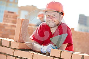 Construction mason worker bricklayer photo