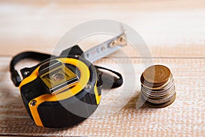 Construction measuring tape and coins