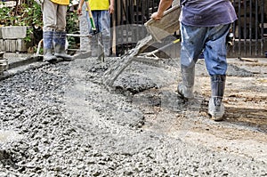 Construction Men Pouring Cement