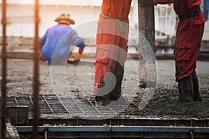 Construction men worker control boom concrete