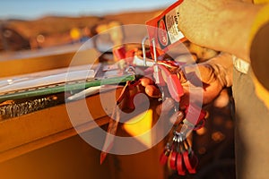 Construction miner placing personal red danger lock which is attached together with danger tag into isolation safety control lock