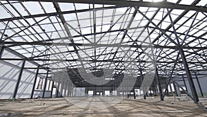 Construction of modern factory or warehouse, modern industrial exterior, panoramic view. Modern storehouse construction