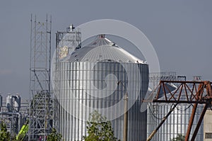 Construction of a modern grain terminal on a blue sky background