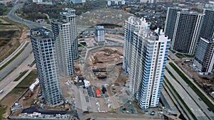 Construction of modern multi-storey buildings. Construction of a new city block. Buildings under construction site. Aerial photogr