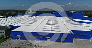 The construction of a modern production building or factory, the exterior of a large modern production plant or factory