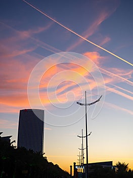 Construction of a multi-storey building against the backdrop of the sunset sky. Construction at the resort. Landscapes of Batumi.