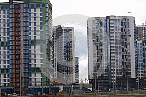 Construction of multi-storey buildings. Modern multi-storey building. Completed and under construction buildings. Construction