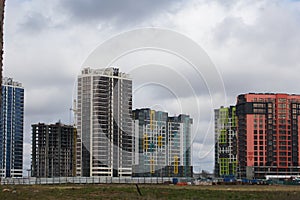 Construction of multi-storey buildings. Modern multi-storey building. Completed and under construction buildings. Construction