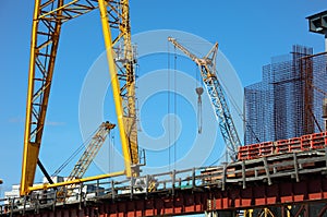 Construction of new bridge with cranes