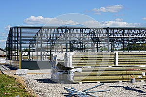 Construction of a new modern industrial building, metal truss frame