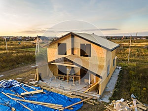 Construction of new and modern modular house. Walls made from composite wooden sip panels with styrofoam insulation inside.