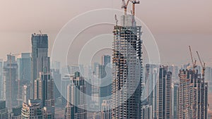 Construction of new modern skyscraper in Dubai city aerial timelapse, United Arab Emirates