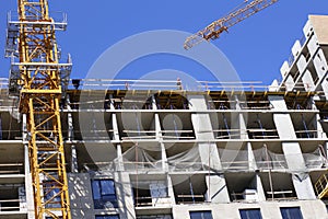 The construction of a new multi-storey building. Construction of a new frame energy-efficient home