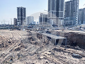 Construction of a new residential area in the city. high-rise buildings in the city center. glass houses made of blocks for people