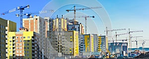 Construction of new residential buildings against the sky .