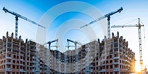 Construction of new residential buildings against the sky .