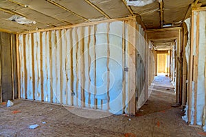 Construction of a new residential home involves installation of insulation walls