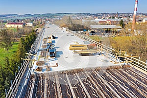 Construction of the new road bridge. Concrete layer with material from above