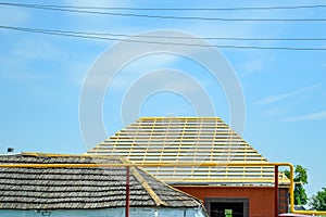 Construction of new roof at home. Nailed wooden slats