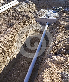 Construction new septic sewage tank sewer pipe trench system installation