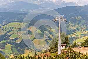 Construction of a new ski lift. Support pole, no steel ropes, standing alone on the slope. Upper ski lift station.