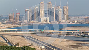 Construction of new skyscrapers in Dubai Creek Harbor aerial timelapse. Dubai - UAE.