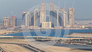 Construction of new skyscrapers in Dubai Creek Harbor aerial timelapse. Dubai - UAE.