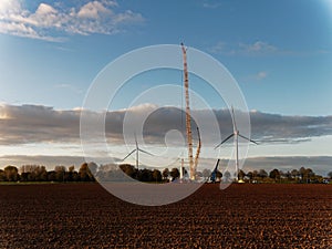Construction of a new wind turbine on a field with a special crane