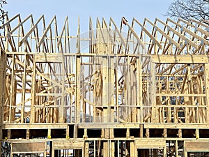 Construction of a new wooden residential building framework during daytime