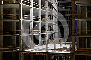 Construction at night. Multi-storey building.