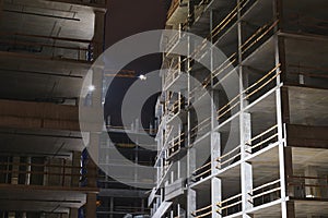 Construction at night. Multi-storey building.