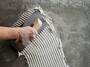 Construction notched trowel with white cement