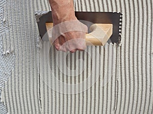 Construction notched trowel with white cement