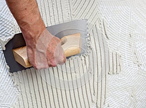 Construction notched trowel with white cement