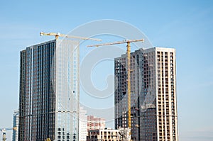 construction od building. industrial crane at construction site. architecture. constructing skyscraper. construction crane