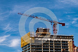 construction od building. industrial crane at construction site. architecture. constructing skyscraper. construction