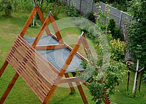 Construction of a pergola shading the kindergarten playground with a sandpit. board battens are just the place where it is necessa