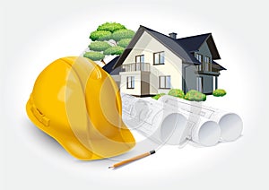 Construction plans and yellow helmet on the background of a dream house.