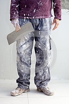 Construction plaster plaster man dirty trousers