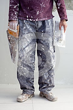 Construction plaster plaster man dirty trousers