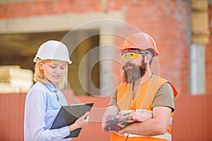 Construction project inspecting. Construction site safety inspection. Discuss progress project. Safety inspector concept