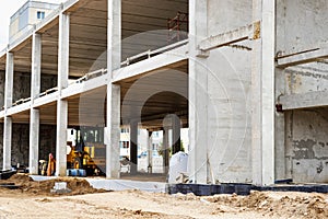 Construction of a reinforced concrete building. Elements of a concrete house. Structural elements. Construction site. Foundations