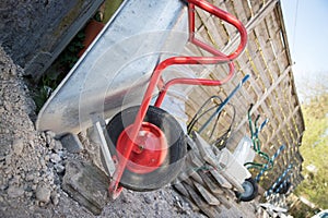 Construction and renovation: Close up of a wheelbarrow on a construction site