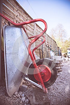 Construction and renovation: Close up of a wheelbarrow on a construction site