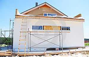 Construction or repair of the rural house with insulation, eaves, roofing