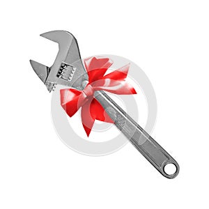 Construction, repair, tools - Gift adjustable spanner a red bow. Isolated