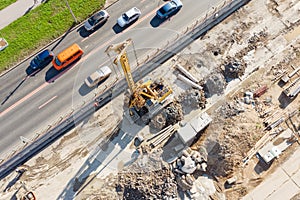 Construction of a road junction for a bridge on a highway, laying communications under the ground, wires, drainpipes. Aerial view