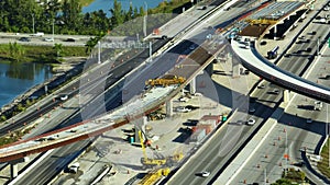 Construction roadworks on american transport infrastructure. Renovation of highway road interchange with moving traffic