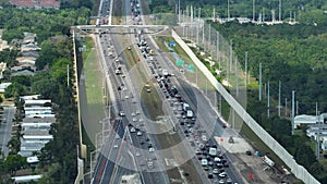 Construction roadworks on American transport infrastructure. Renovation of highway road interchange with slow moving